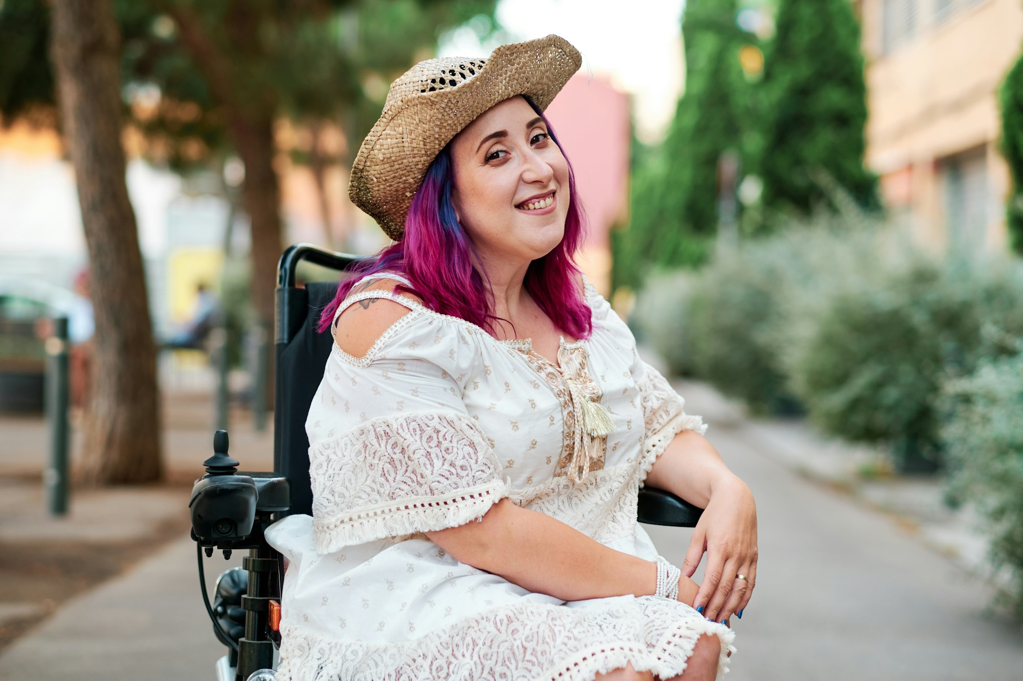 woman with disabilities in a wheelchair looking at camera